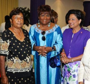 From left: Rose Rajbansee, Gia Gaspard Taylor, Prime Minister Kamla Persad Bessissar